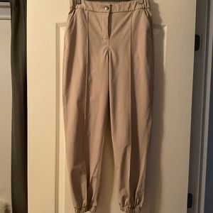 2 pairs of Lululemon Joggers Size 6. 1 beige and 1 black